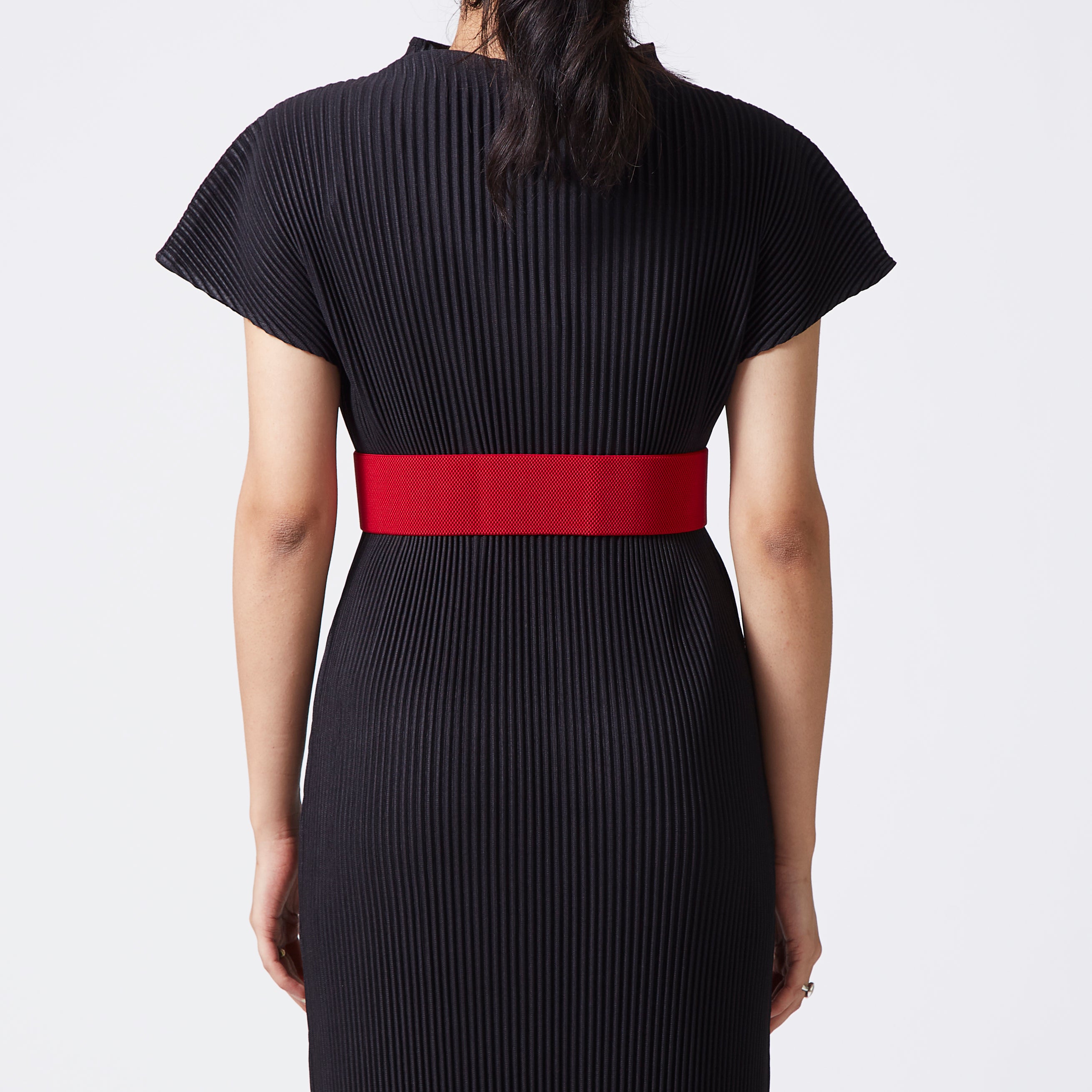 Red elastic-backed belt with gold distended buckle
 Red elastic-backed belt with gold distended buckle