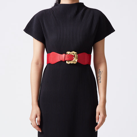 Red elastic-backed belt with gold distended buckle
 Red elastic-backed belt with gold distended buckle