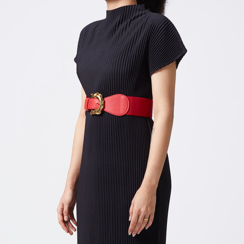 Red elastic-backed belt with gold distended buckle
 Red elastic-backed belt with gold distended buckle