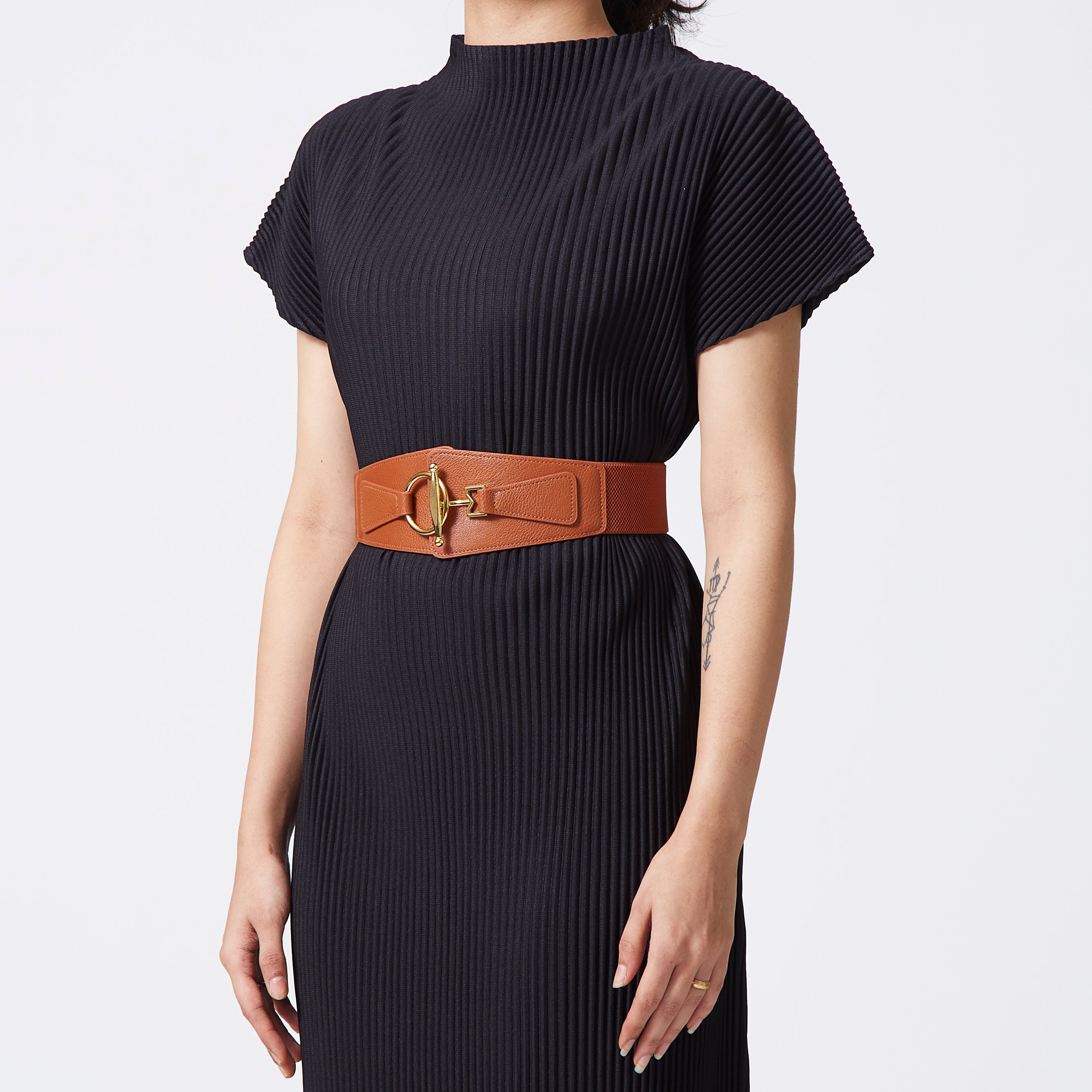 Tan elastic-backed faux leather belt with gold buckle
 Tan elastic-backed faux leather belt with gold buckle