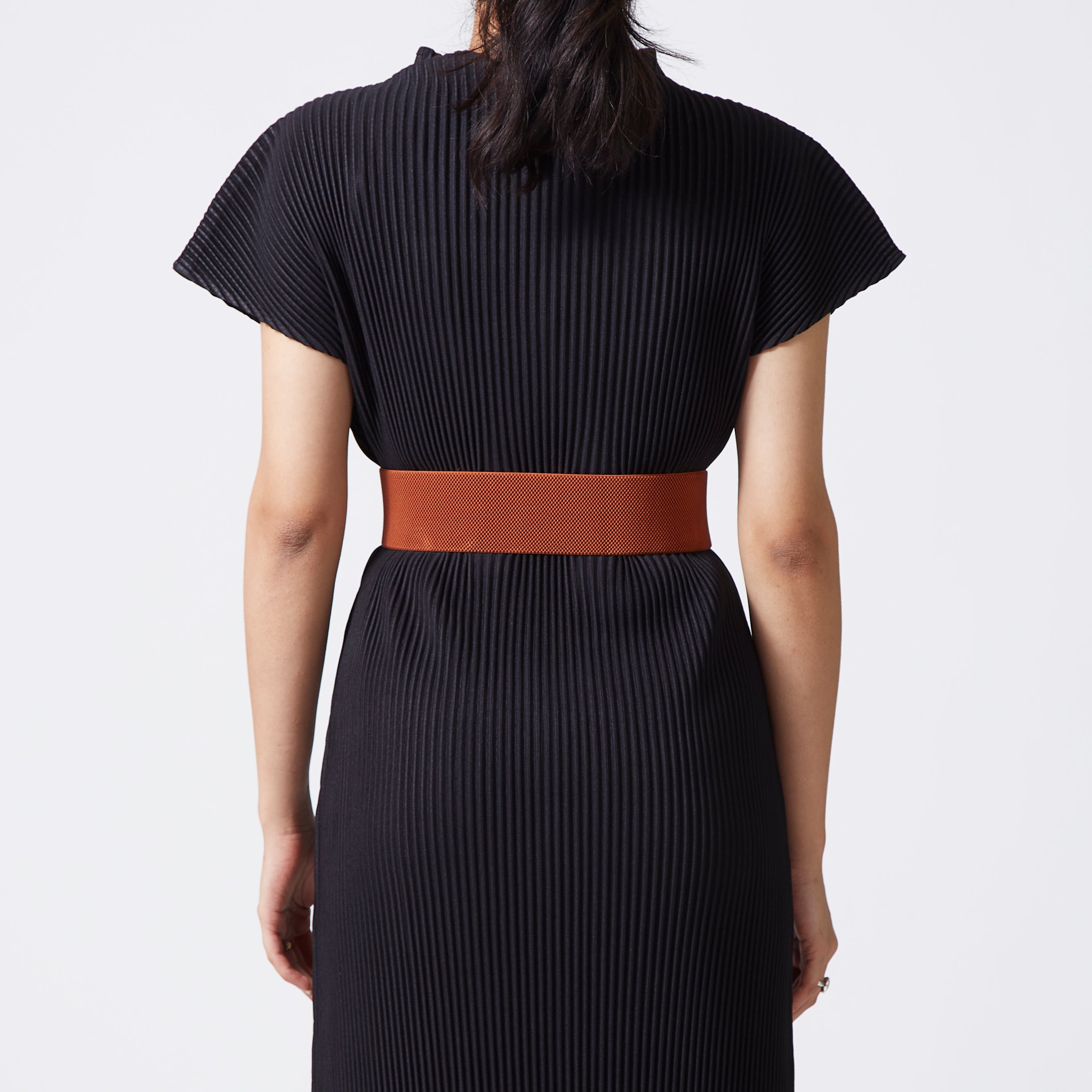 Tan elastic-backed faux leather belt with round gold buckle
 Tan elastic-backed faux leather belt with round gold buckle