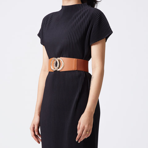 Tan elastic-backed faux leather belt with round gold buckle
 Tan elastic-backed faux leather belt with round gold buckle