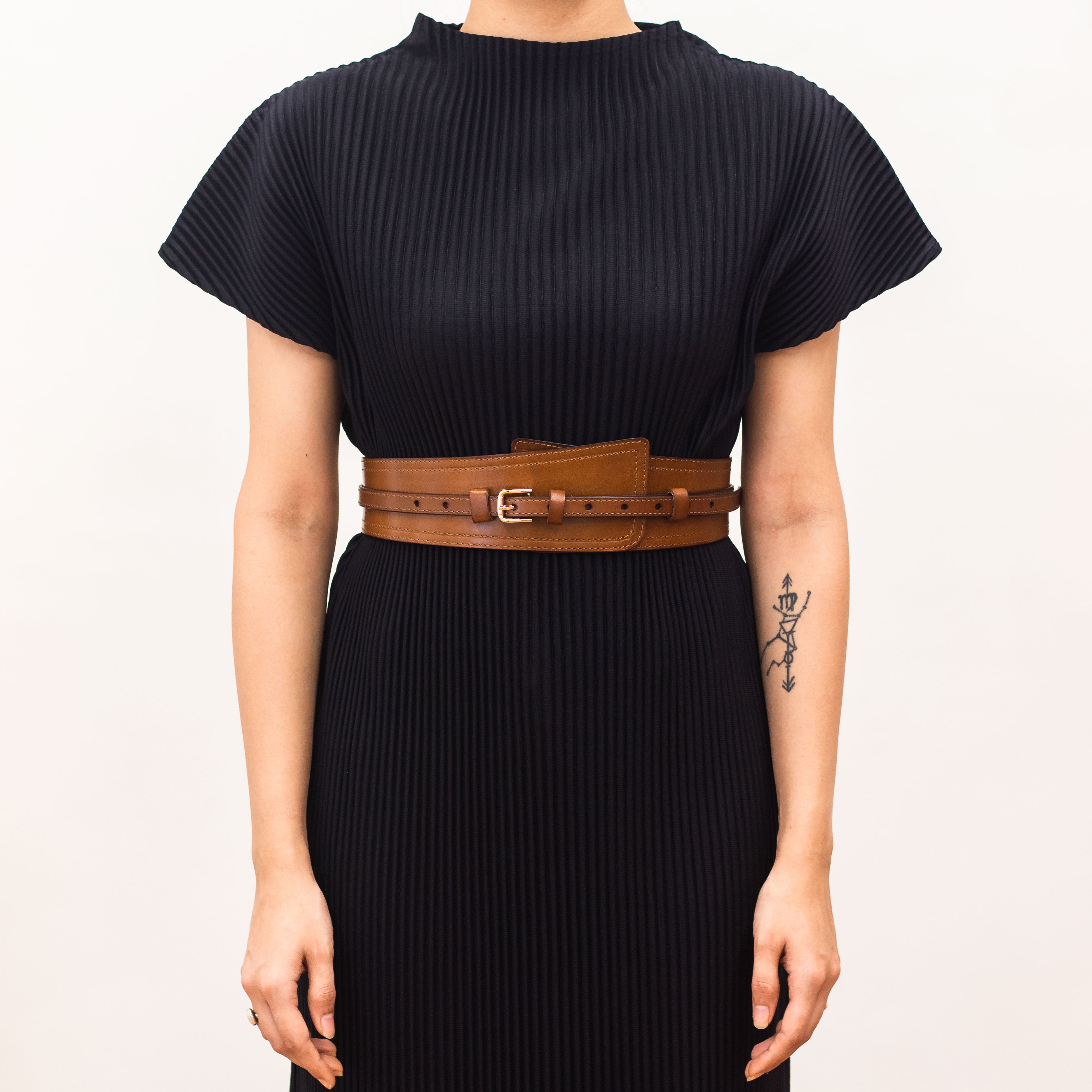 Brown crossbody with buckle clasp.
 Brown crossbody with buckle clasp.